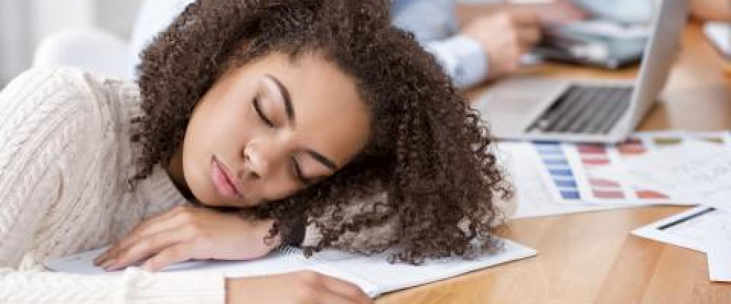 Woman falling asleep in a meeting