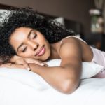 woman sleeping on bed