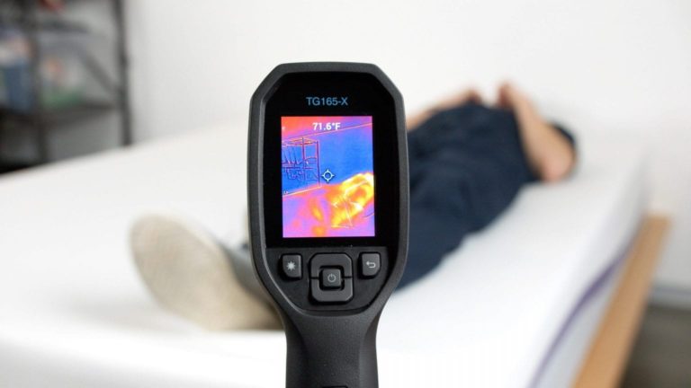 Sleep Foundation team testing a Purple mattress for heat retention with a thermal imaging camera