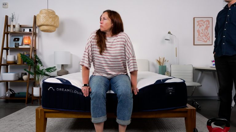 Sleep Foundation tester evaluating the DreamCloud Classic Hybrid mattress