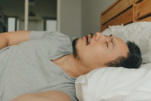 Man with sleep apnea sleeping in bed.