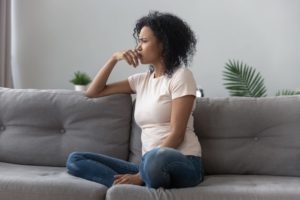 woman worrying on couch