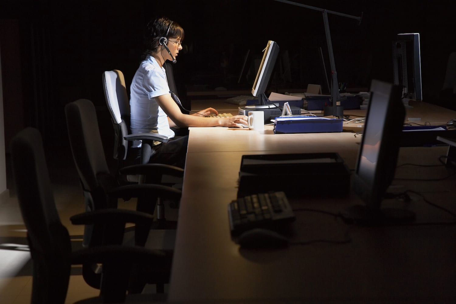 woman working at a desk at night