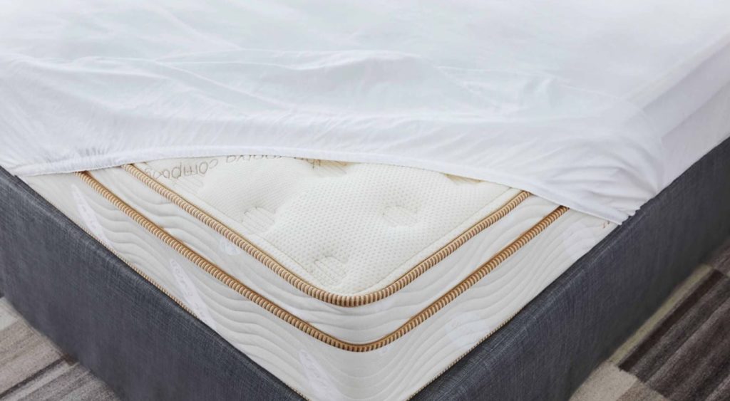 Close up product page image of the Saatva Mattress Protector