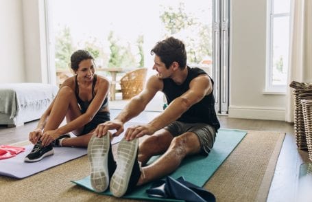 man and woman working out at home