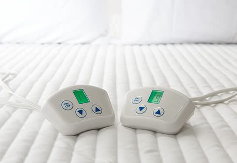 Product page image of the Sharper Image Dual Heated Mattress Pad