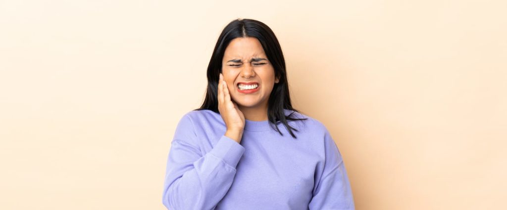 A woman with jaw pain