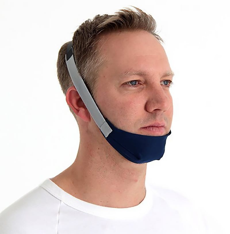 Man wearing a CPAP chinstrap