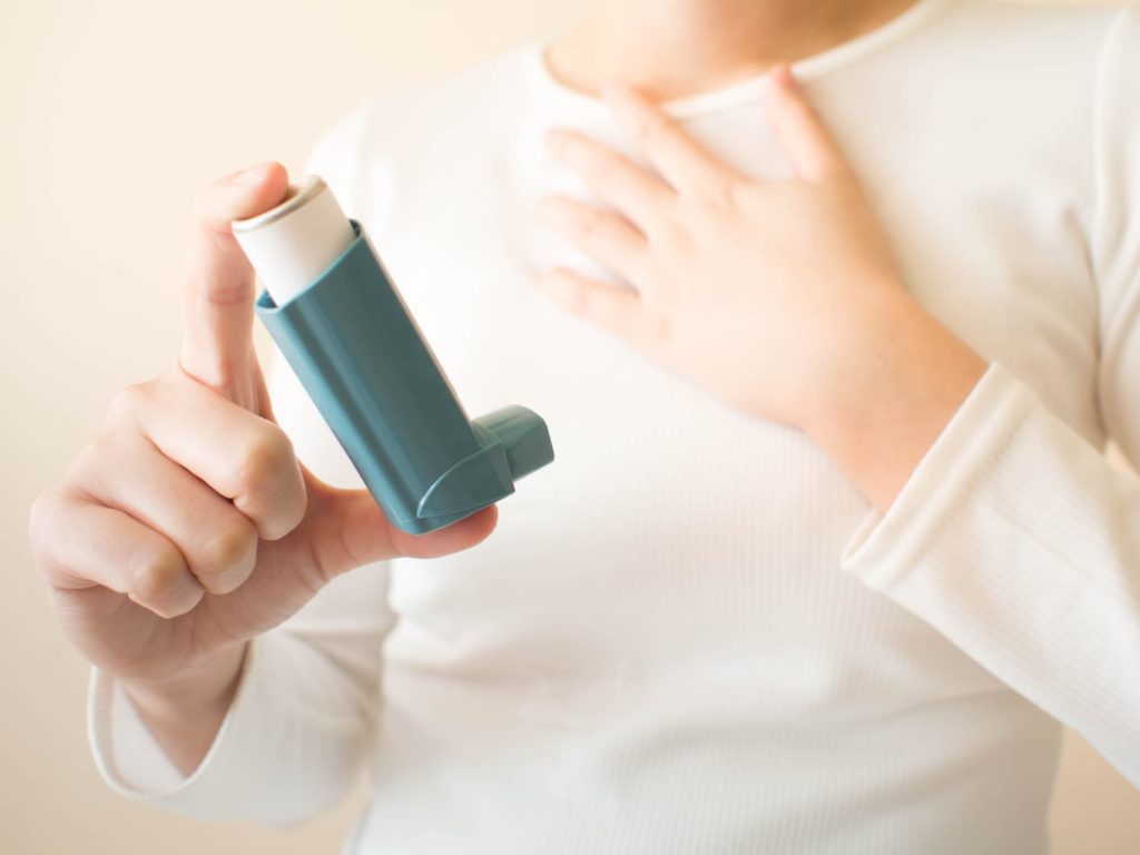 woman with inhaler