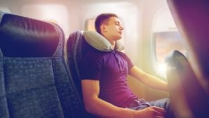 man sleeping on a plane
