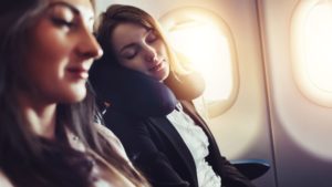 woman sleeping on a plane