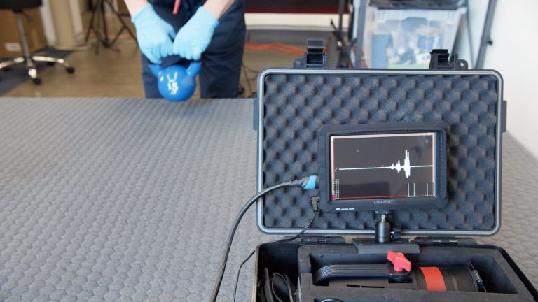 Sleep Foundation testing the Layla Hybrid mattress for motion isolation with a kettlebell