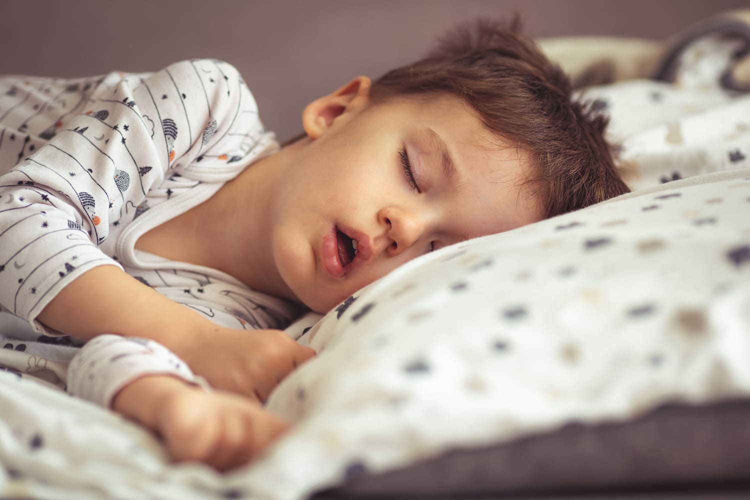 Child snoring in bed
