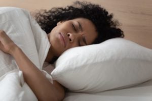 Woman having breathing problems while sleeping