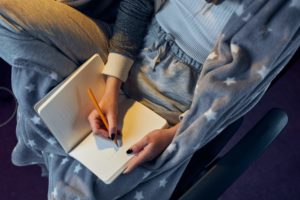 Woman writing in dream journal