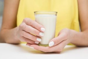 Woman holding warm milk