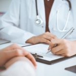 Doctor talking with patient