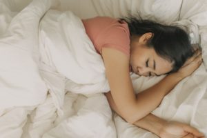 Young woman drooling in her sleep