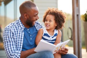 A Father and child reading together