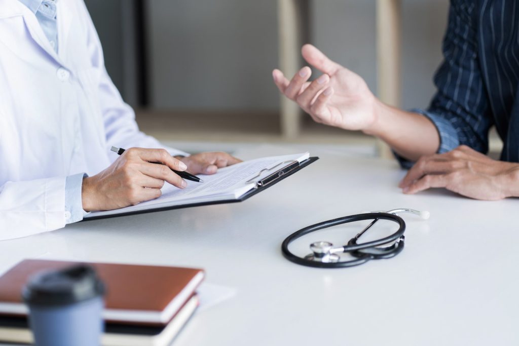 A person discusses their medial concerns with a health professional