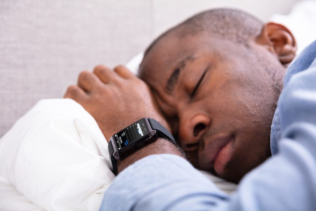 man with wristwatch sleeping