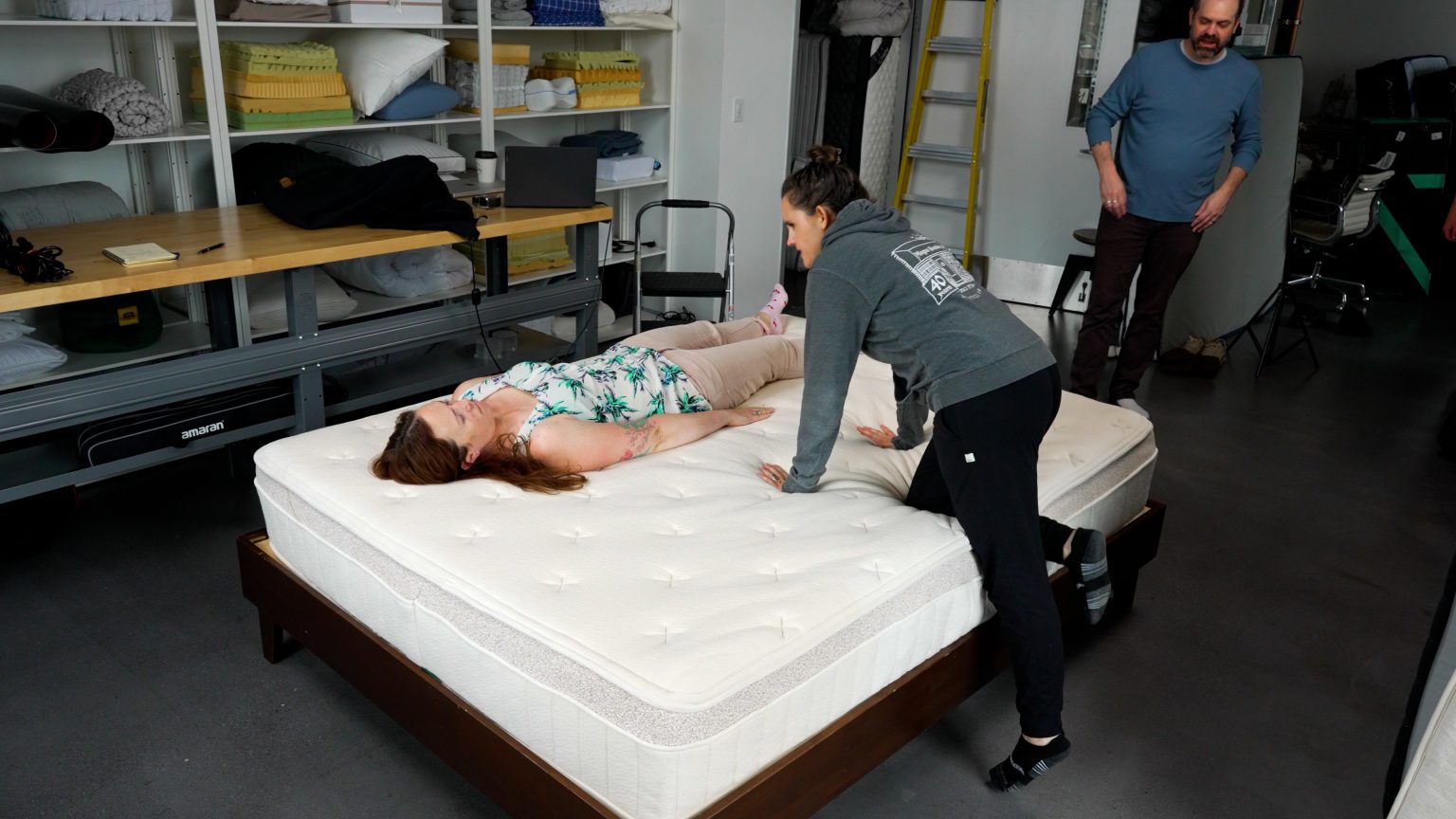 Sleep Foundation tester evaluating the Birch Luxe Natural Mattress during hands-on testing