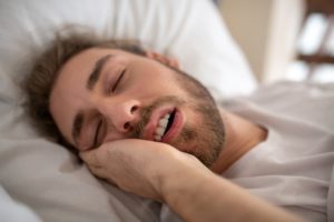 man sleeping with mouth open