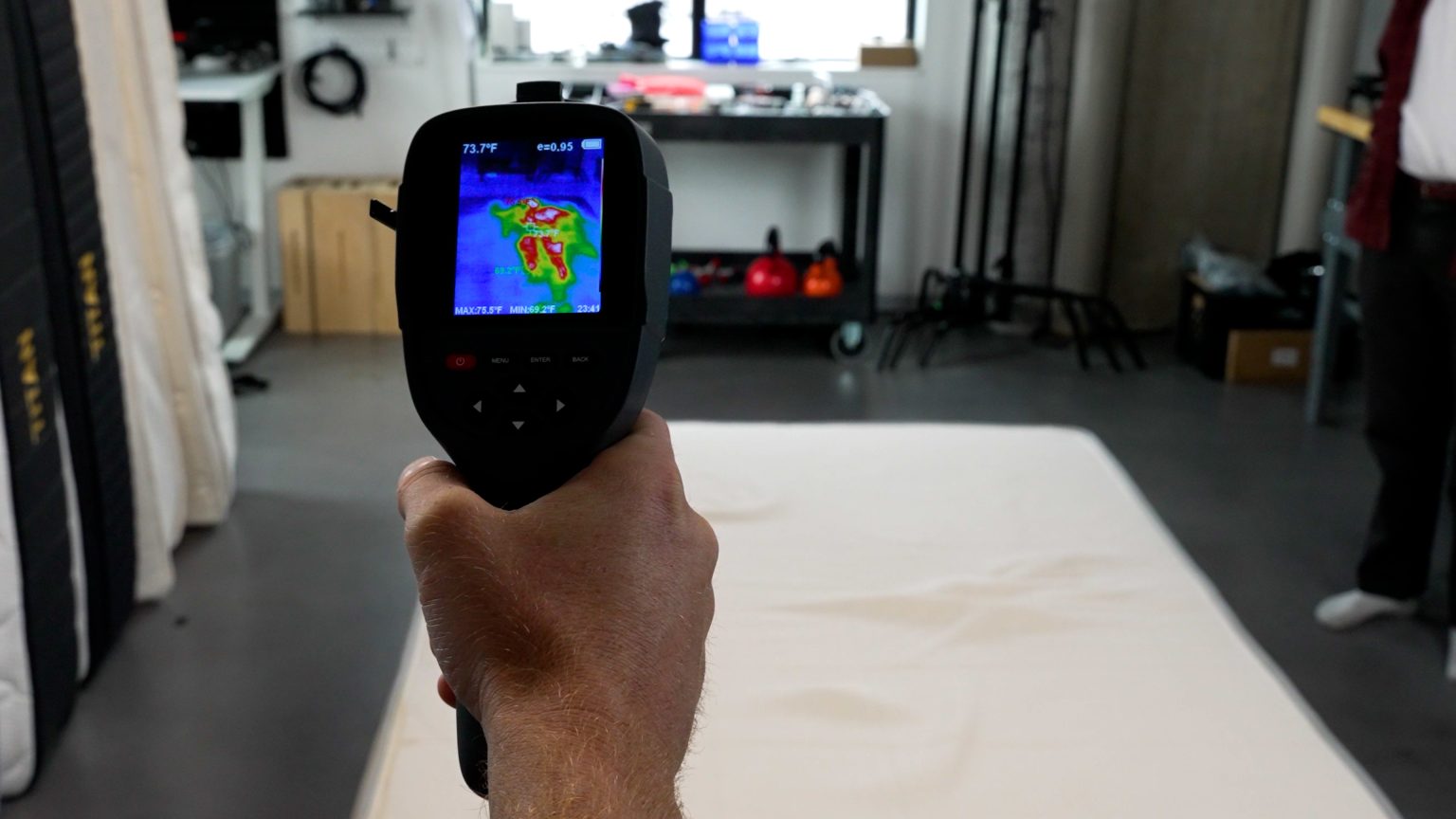 Sleep Foundation testing the Nolah Natural 11 mattress with a thermal camera to measure heat retention in the Seattle Test Lab