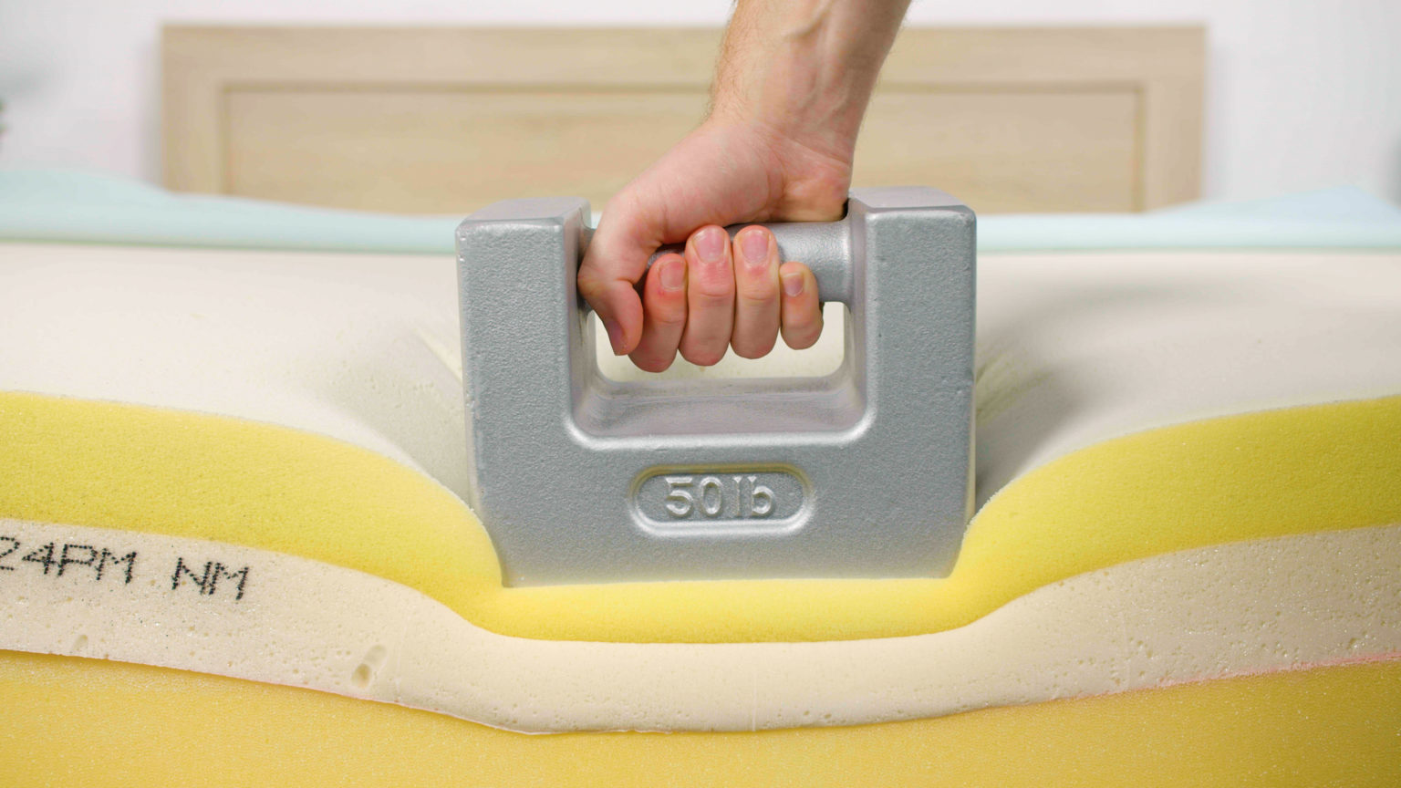 Weight compressing the edge of the TEMPUR-Breeze mattress during edge support testing