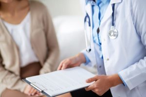 Stock photo of a doctor holding a clipboard