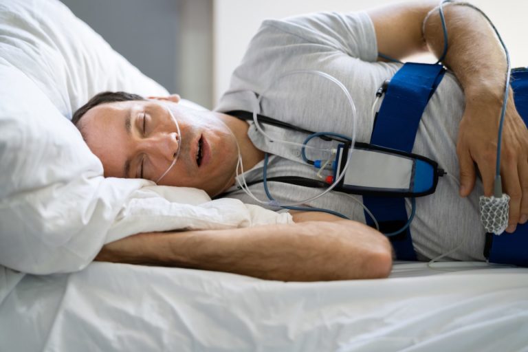 man using machine while sleeping