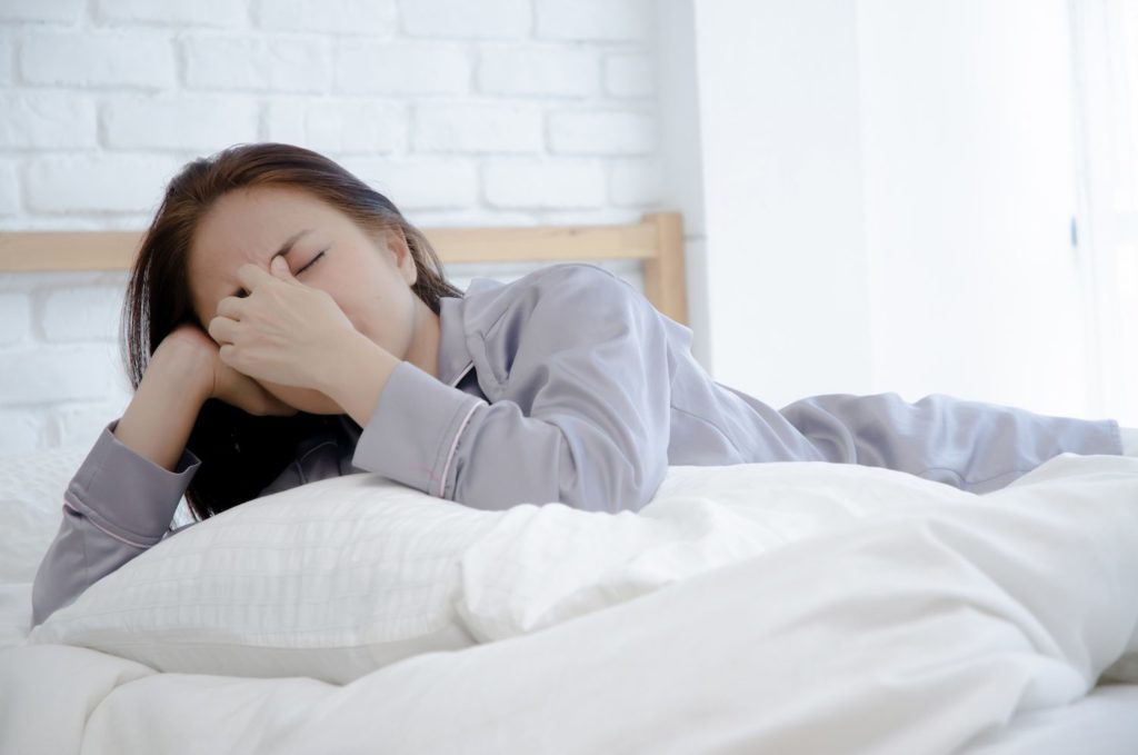 Paradoxical Sleep woman pinching nose