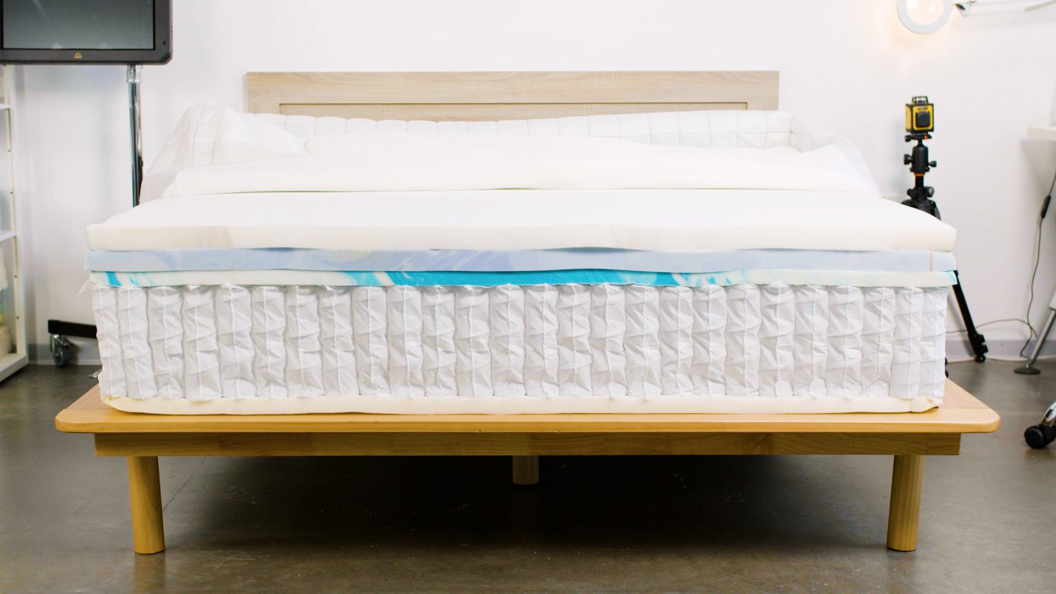 Helix Plus mattress with its foam and pocketed coil layers exposed for testing