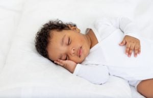 A baby sleeps peacefully.
