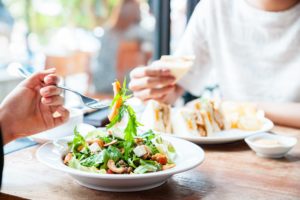 Two people eating a meal