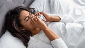 stock photo of a woman with nasal congestion