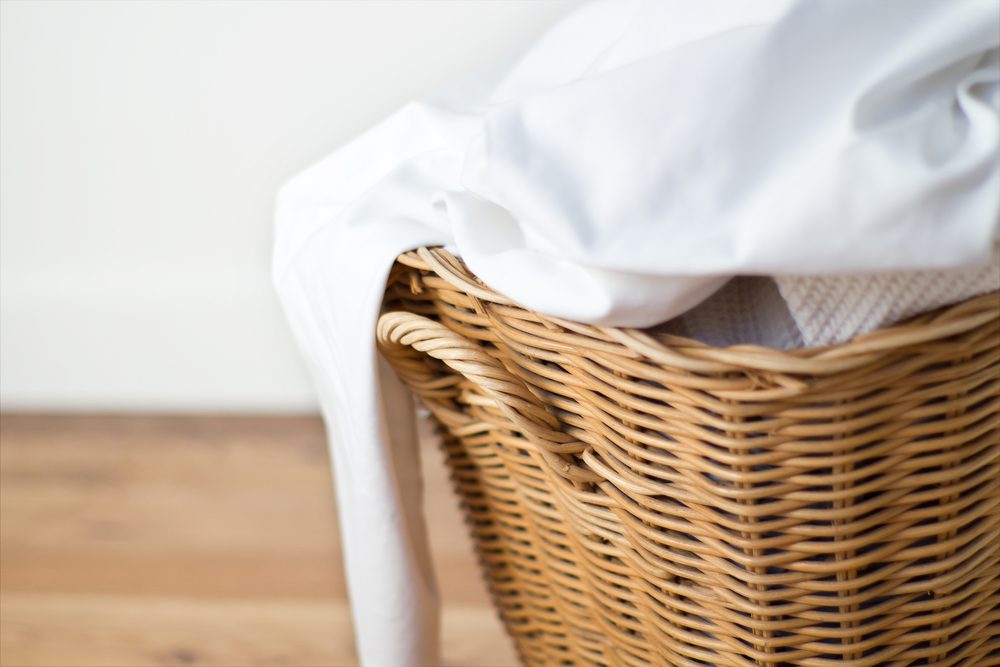 stock photo of sheets in a laundry basket
