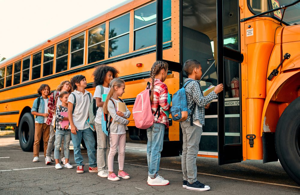 stock photo of children entering schoolbus