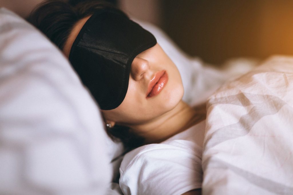 stock photo of a woman with sleeping mask