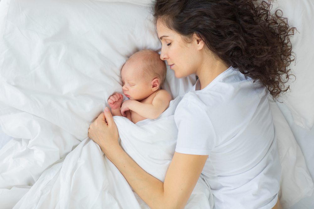 stock photo of a mother and child co-sleeping