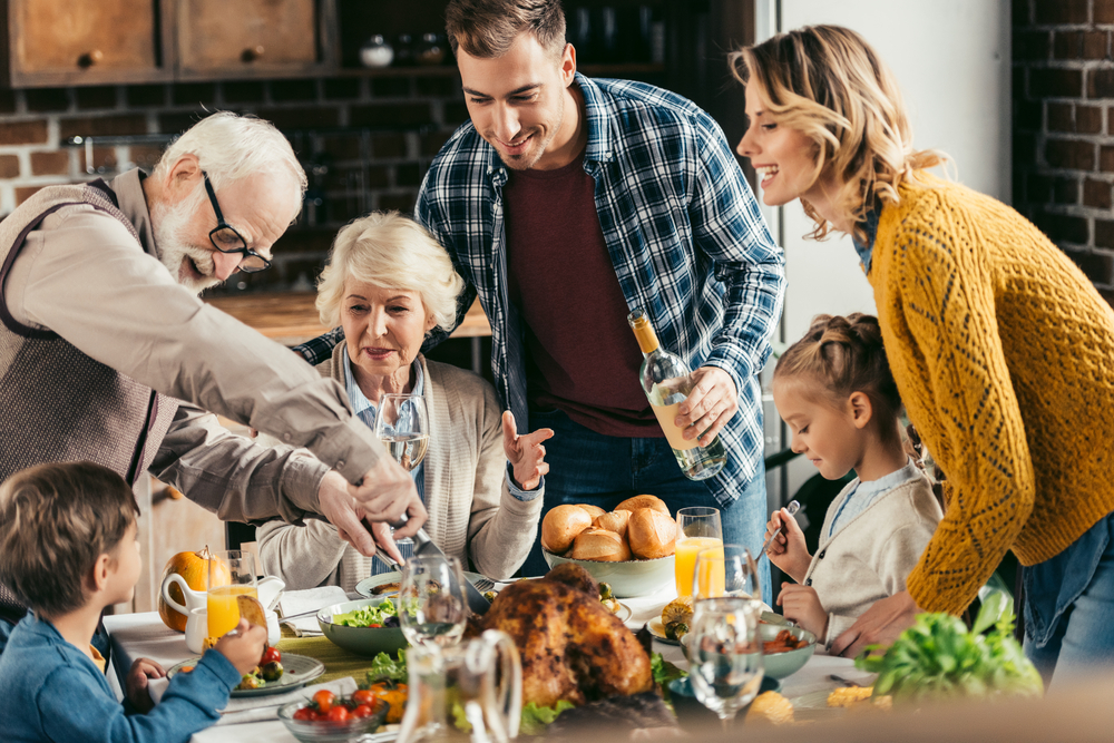 stock poto of a family enjoying Thanksgiving dinner