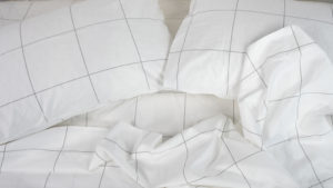 A picture of the Brooklinen Luxe Core Sheet Set in Sleep Foundation's test lab.