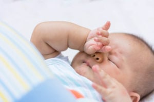 Newborn rubbing eyes