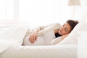 Person sleeping while pregnant