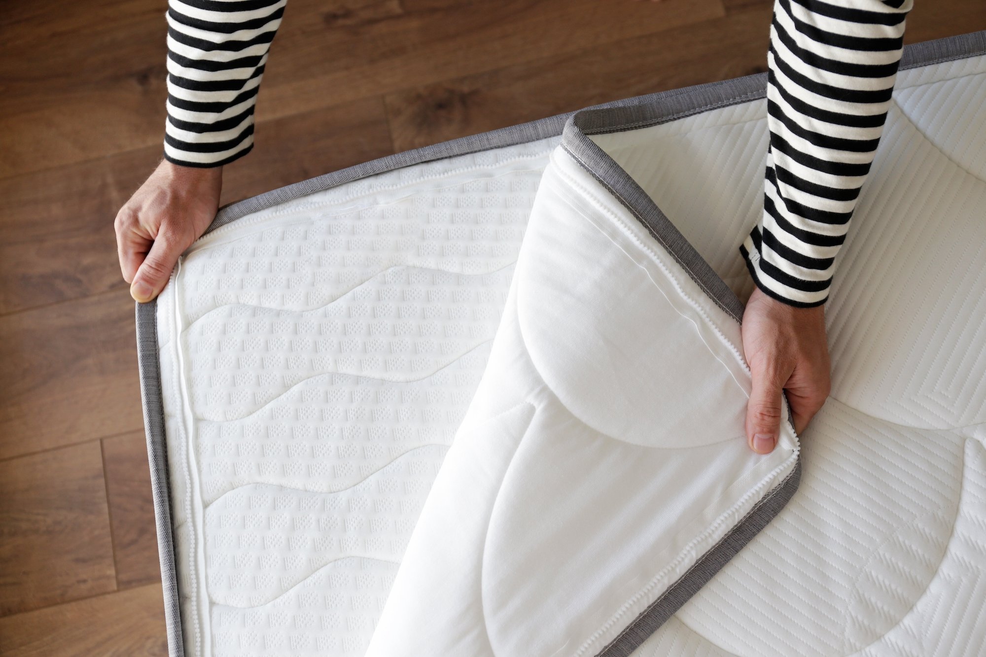 crib mattress pad vs mattress protector