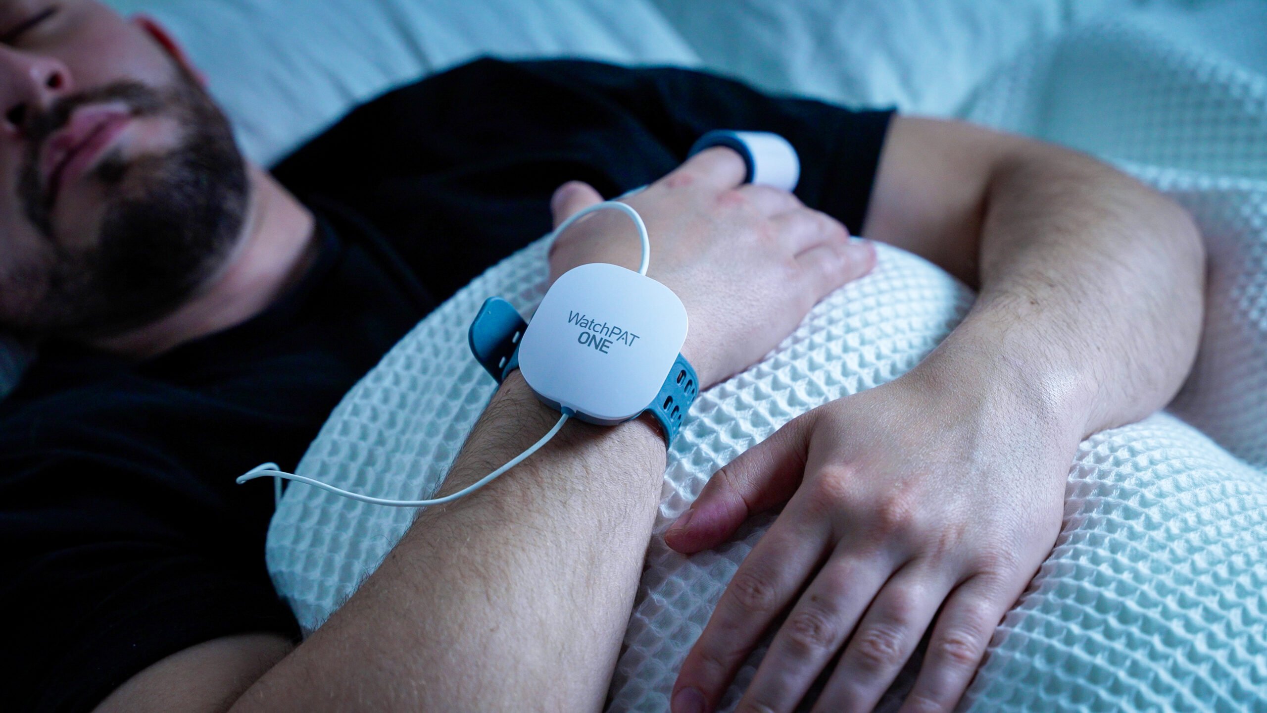 A man wearing the WatchPat ONE sleep test.