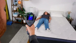 Best Hypoallergenic Mattress of 2026 Sleep Foundation team testing the Helix Midnight Luxe mattress with a thermal imaging camera